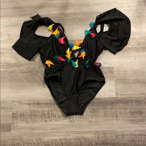 Black one piece with multicolored tassels